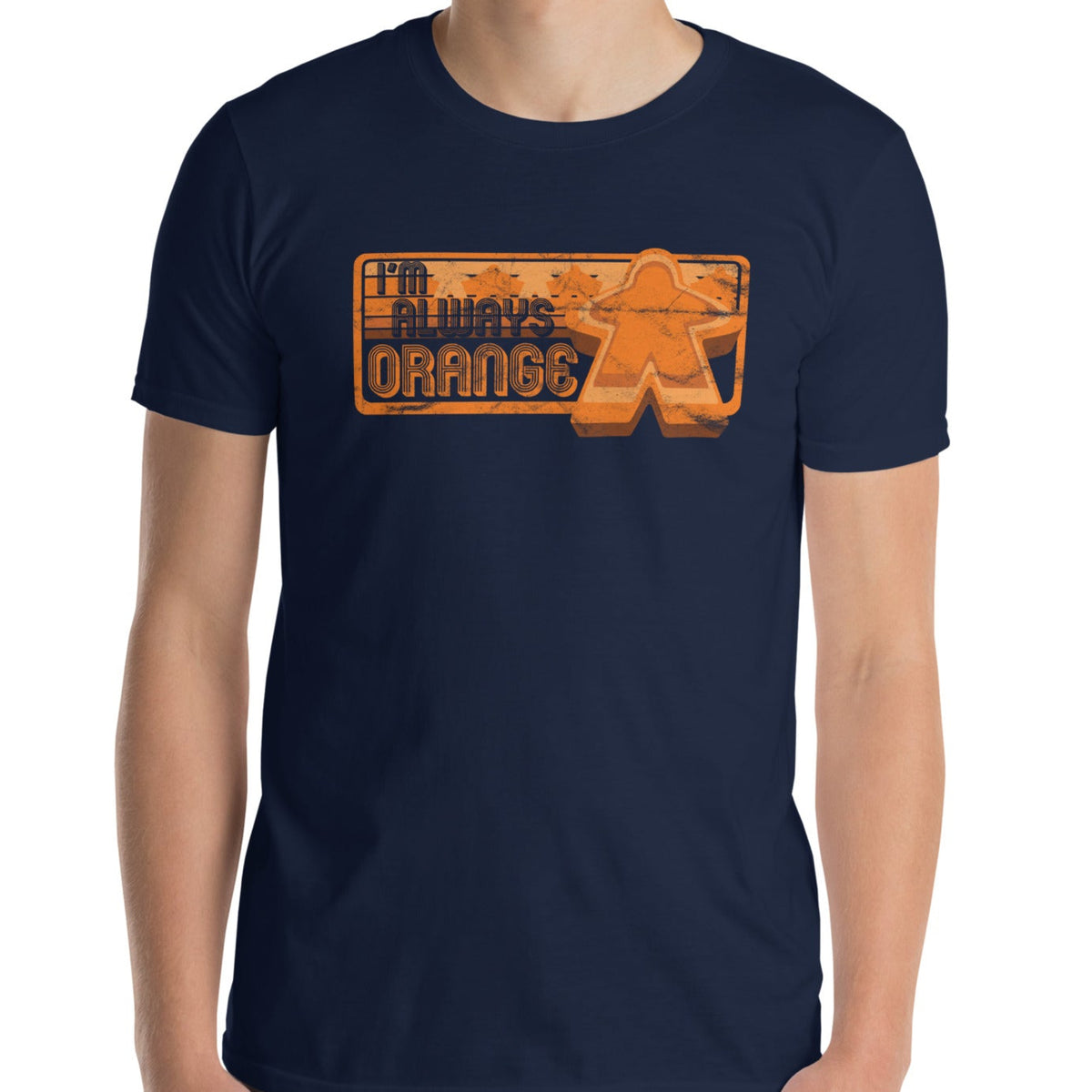 Person wearing a navy blue t-shirt with our I'm Always Orange design on a white background