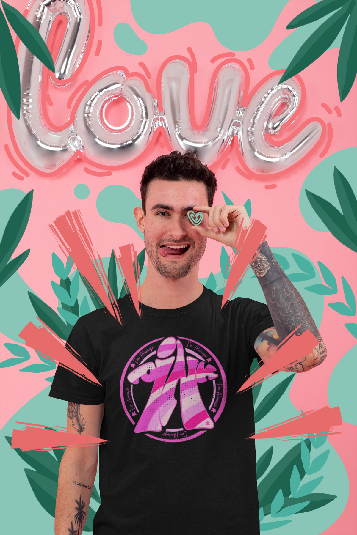 Guy wearing our I'm Always Pink meeple board game t-shirt in front of a vibrant Love design.