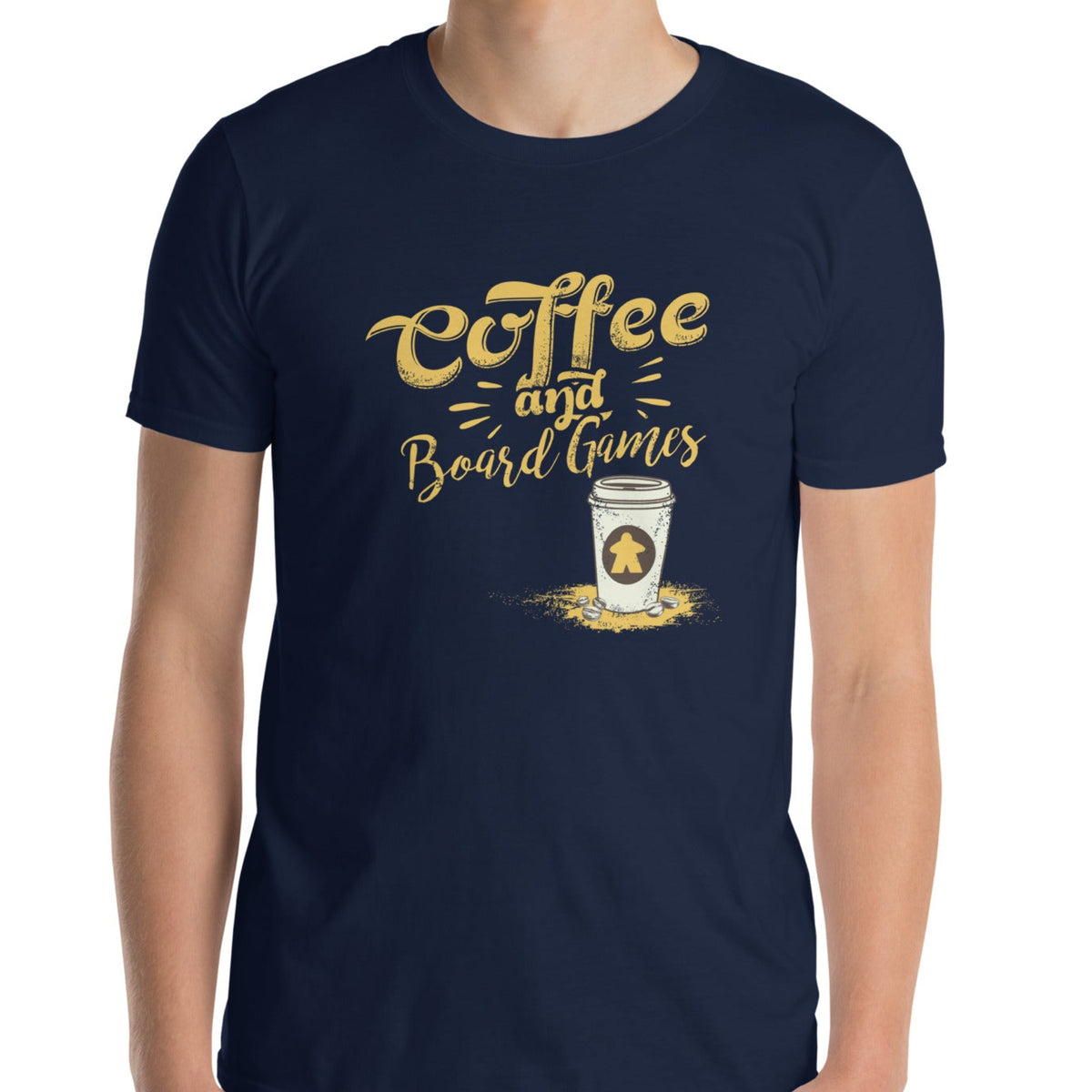 A navy blue t-shirt with the text 'COFFEE AND BOARD GAMES' and an illustration of a to-go coffee cup with a meeple sticker.
