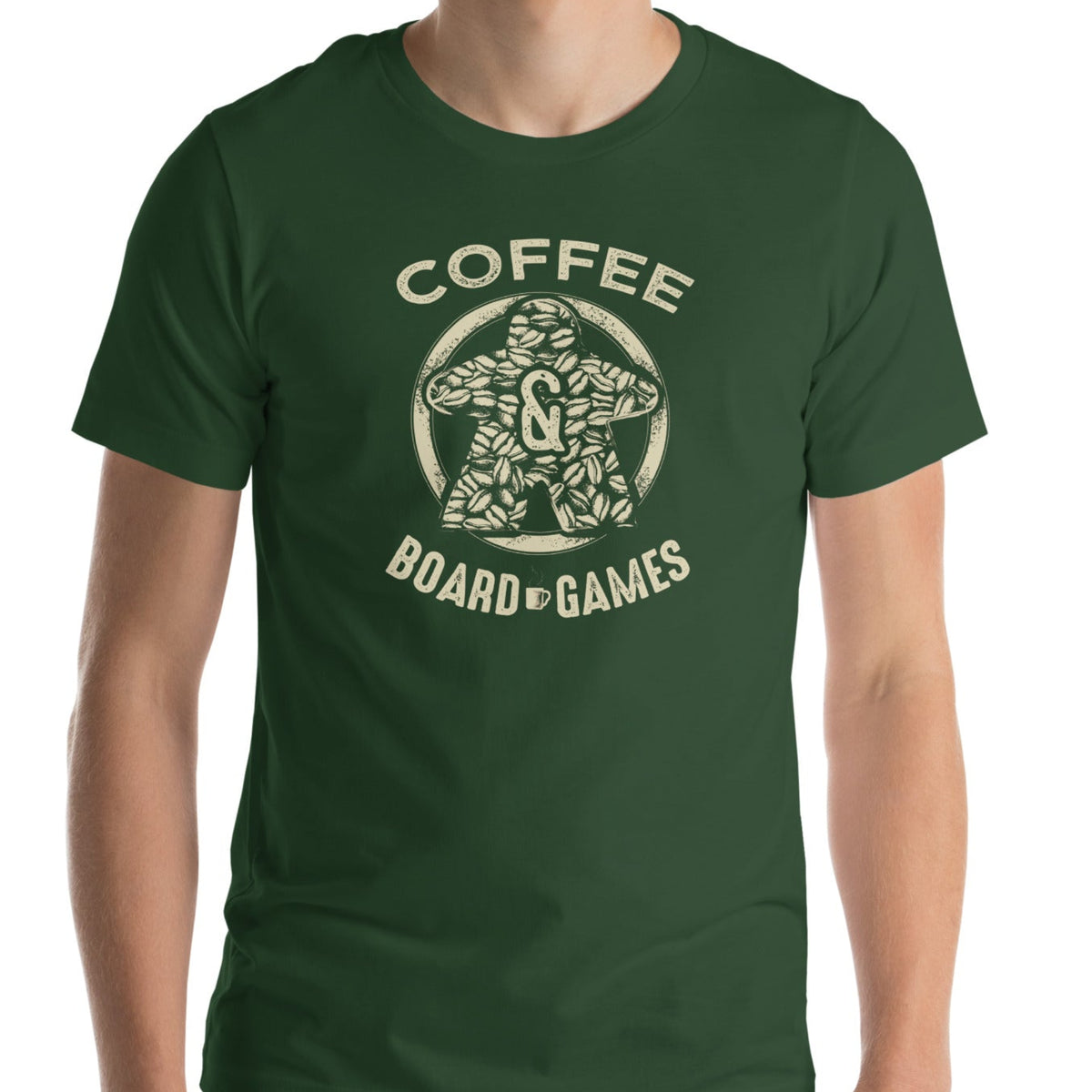 Man wearing a green t-shirt featuring our Coffee & Board Games design