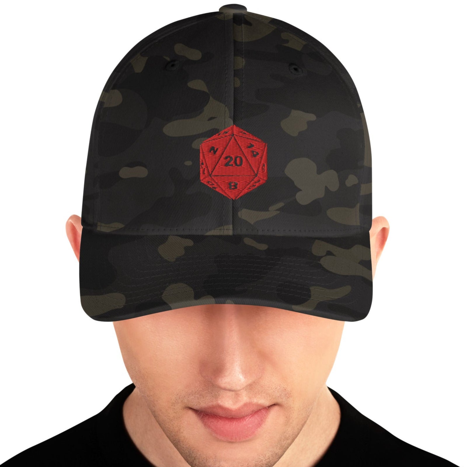 A person wearing a black camouflage cap with a red D20 logo on the front.