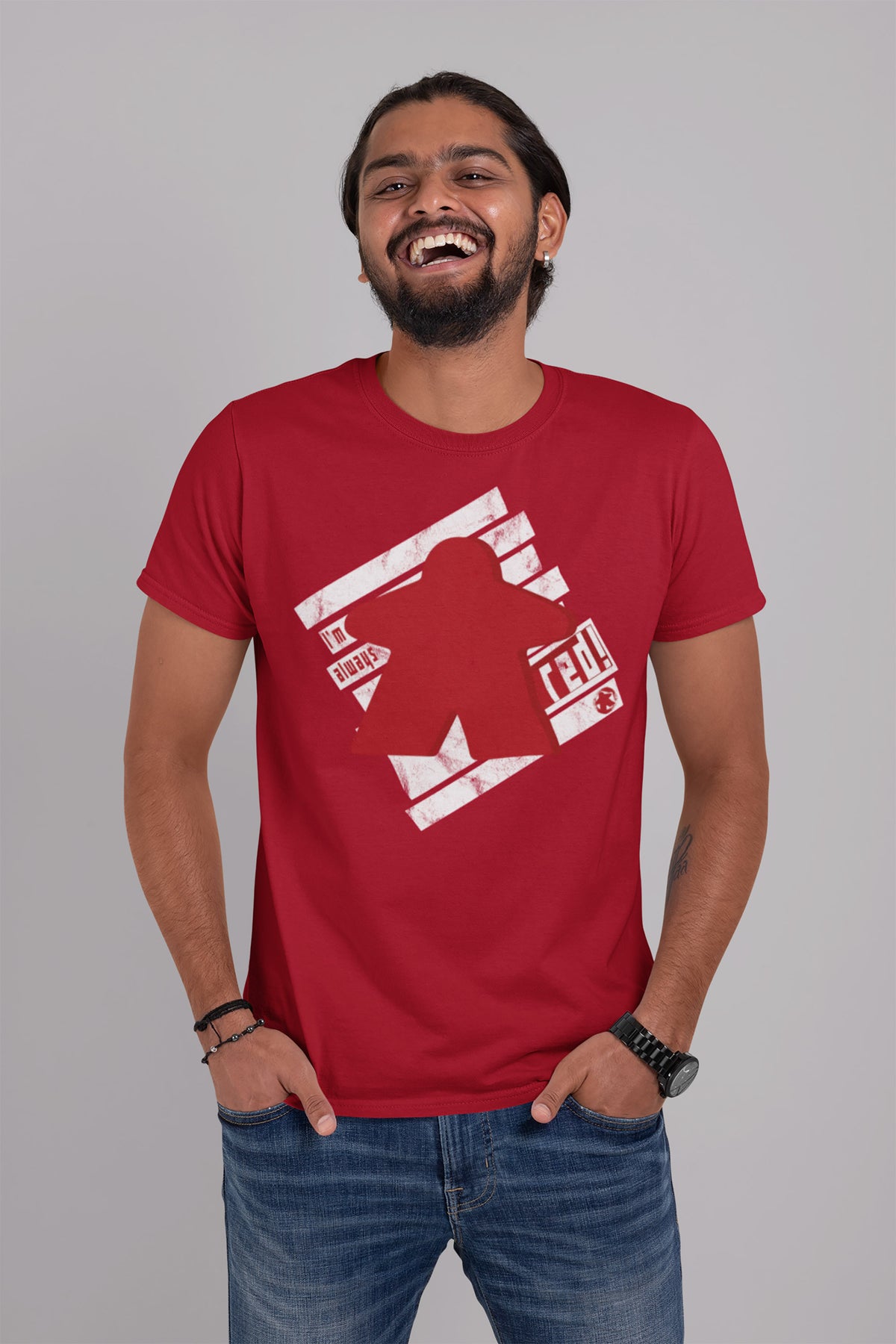 Man wearing a red t-shirt with our I'm Always Red design on a gray background