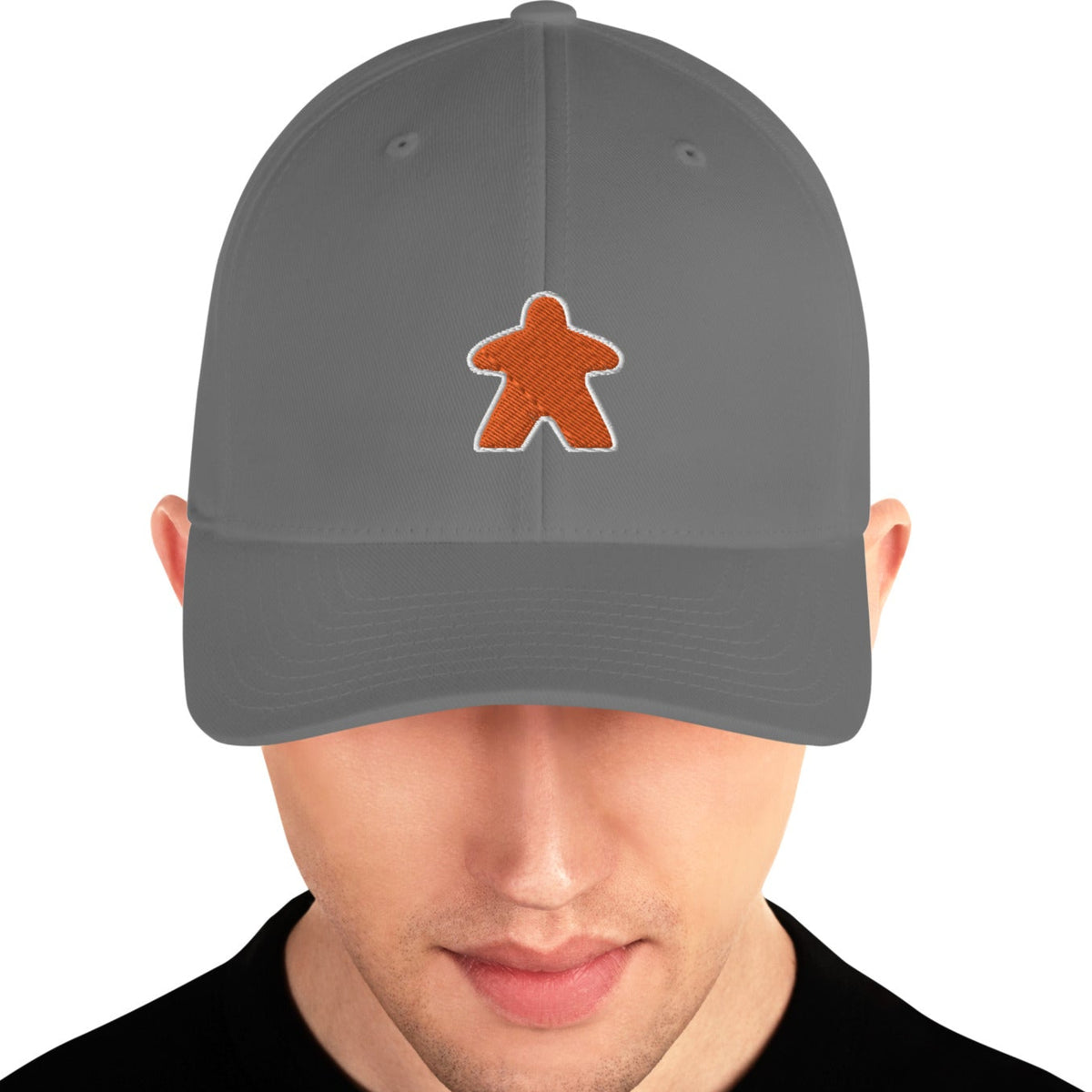 Grey hat worn by a man with an embroidered orange meeple on the front