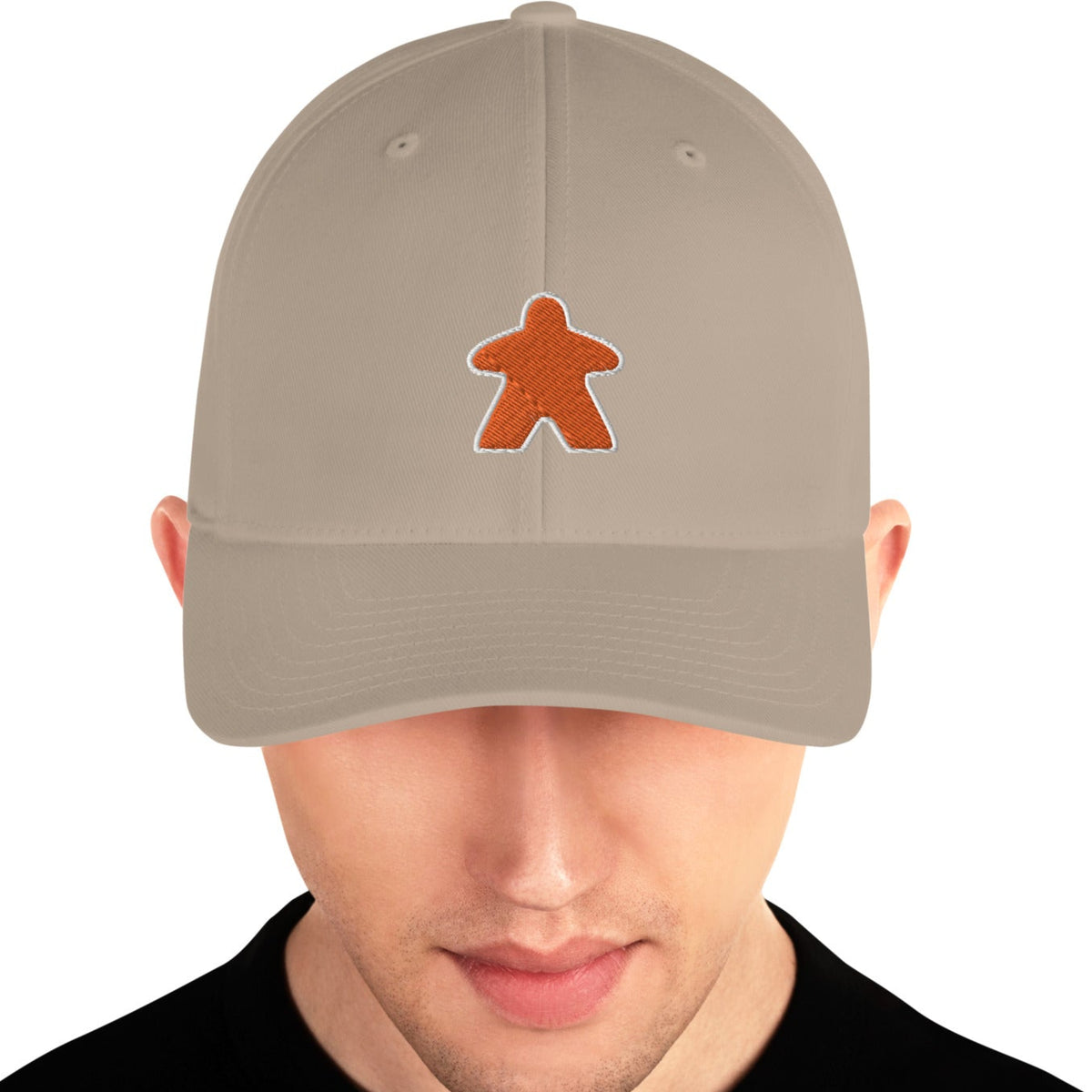 Tan hat worn by a man with an embroidered orange meeple on the front