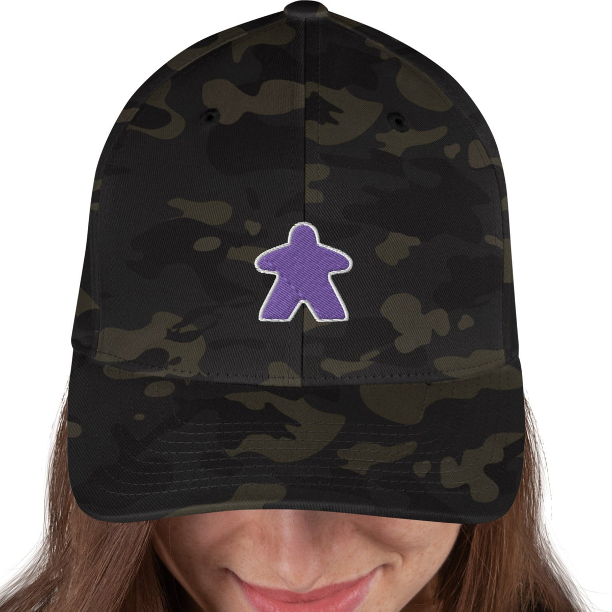 Purple meeple design embroidered on a black camp flexfit baseball cap