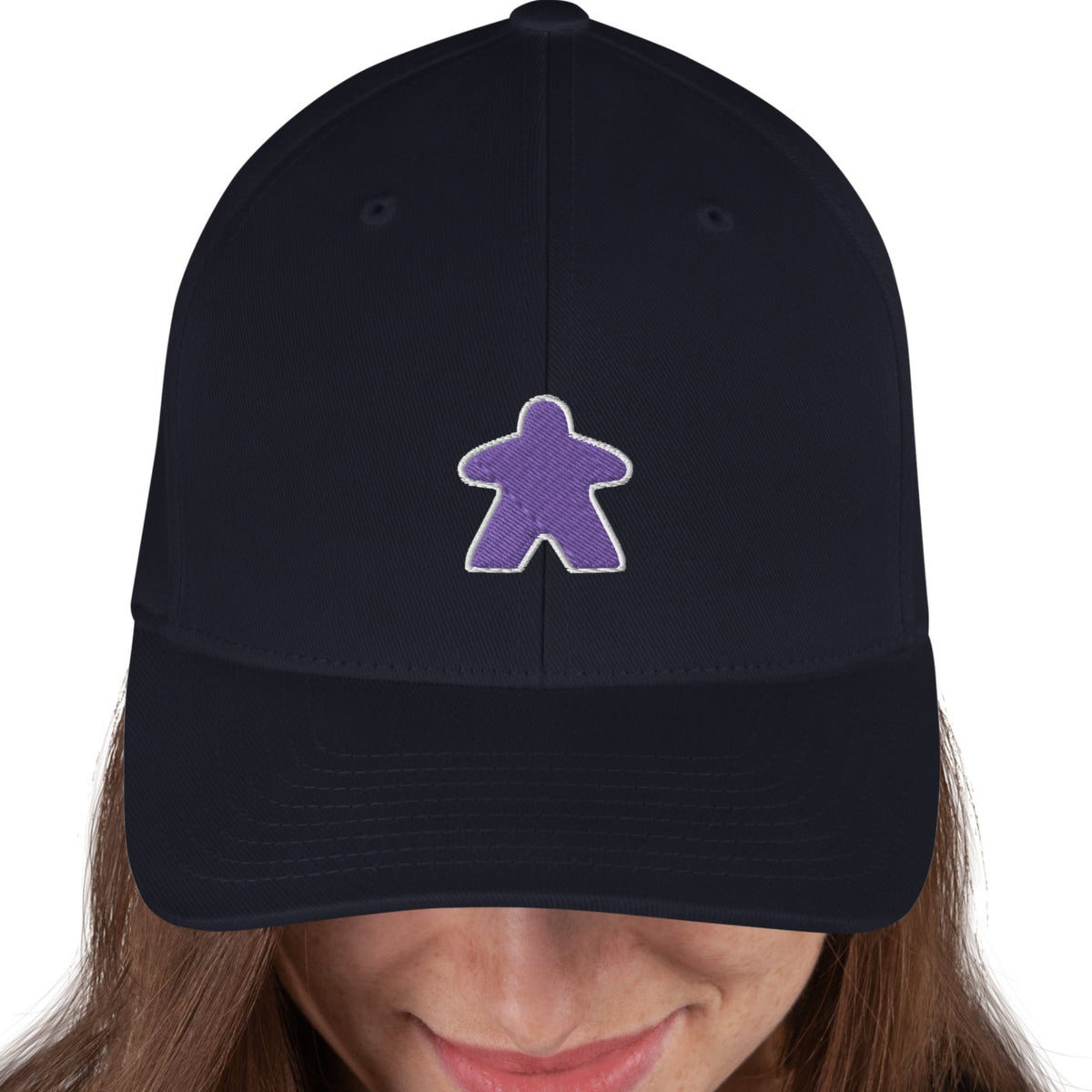 Purple meeple design embroidered on a dark navy flexfit baseball cap