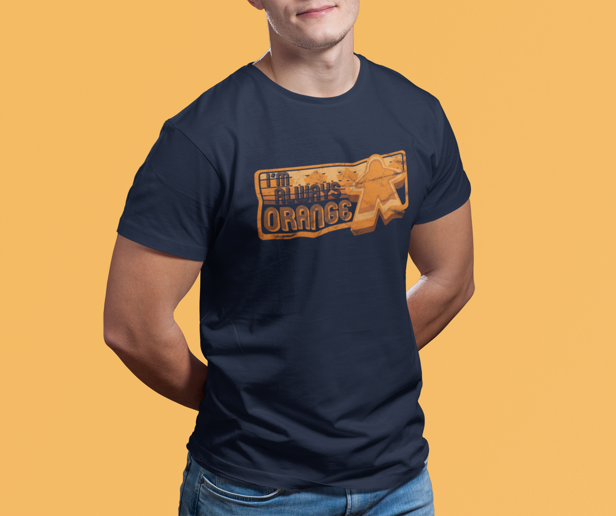 Person wearing a navy blue t-shirt with our I'm Always Orange design on a yellow background