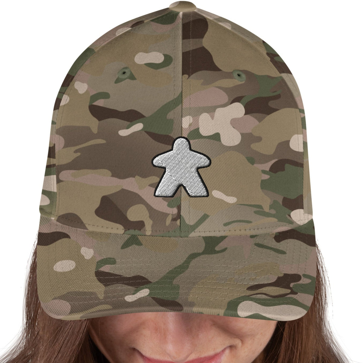 White meeple design embroidered on a camo flexfit baseball cap