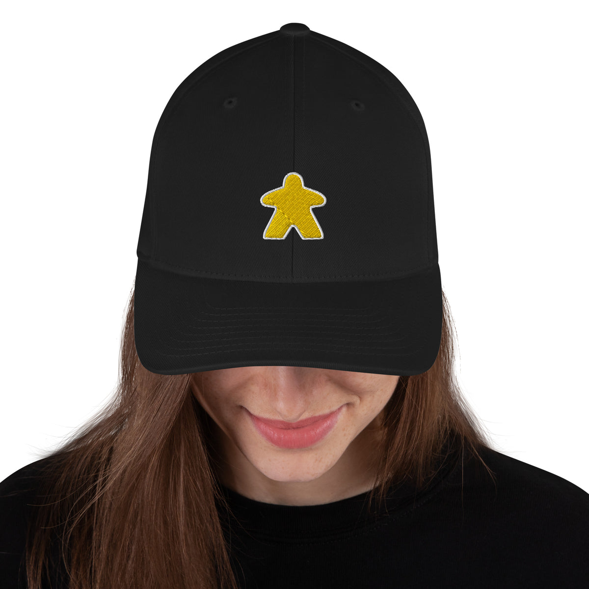 Yellow meeple design embroidered on a black flexfit baseball cap